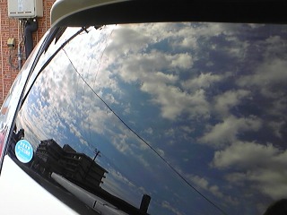 �~�J����